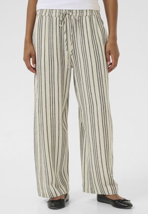 Lightweight, wide-leg pants in cream with dark vertical stripes. Elastic waistband with adjustable drawstring. Soft texture, relaxed fit.