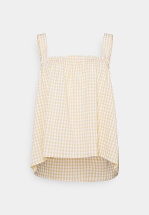 Top senza maniche a scacchi gialli e bianchi con scollatura e spalline elastiche arricciate; l'orlo inferiore è leggermente più lungo sul retro.