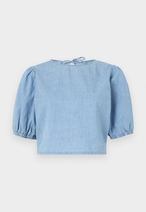 Light blue denim short-sleeve top with puffed sleeves, a round neckline, and a tie closure at the back. Smooth texture and cropped fit.
