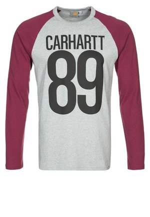 Maglia grigia a maniche lunghe con maniche bordeaux, testo nero "CARHARTT" e grande numero "89" stampati sul davanti. Nessuna persona visibile.
