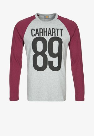 Maglia grigia a maniche lunghe con maniche bordeaux, testo nero "CARHARTT" e grande numero "89" stampati sul davanti. Nessuna persona visibile.