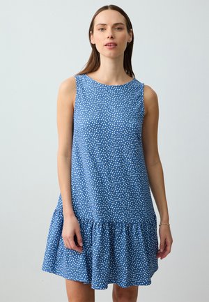 Blaues ärmelloses Kleid mit weißen Pünktchen, mit ausgestelltem Saum und strukturiertem Stoff. Glatter Ausschnitt und lockere Passform, die für Komfort ausgelegt sind.
