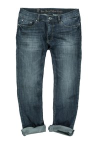 Jeans de mezclilla azul oscuro con corte recto, con dobladillos acampanados, costuras en contraste y cuatro bolsillos. Etiqueta "Solo para hombres de verdad" en la cinturilla.