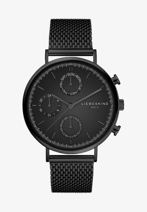 Schwarze analoge Uhr mit einem strukturierten Mesh-Armband, runder Ziffernblatt, Sub-Zifferblätter für Datum und Wochentag sowie minimalistischen Markierungen. Markenname: Liebeskind Berlin.
