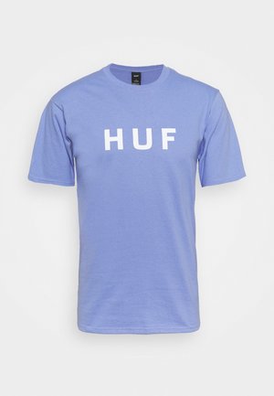T-shirt en coton violet à manches courtes et col rond, arborant le mot "HUF" en lettres blanches en gras sur le devant.