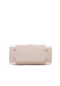 Beige leather handbag with white accents, rectangular shape, gold hardware, and four metal feet on the bottom for stability.
