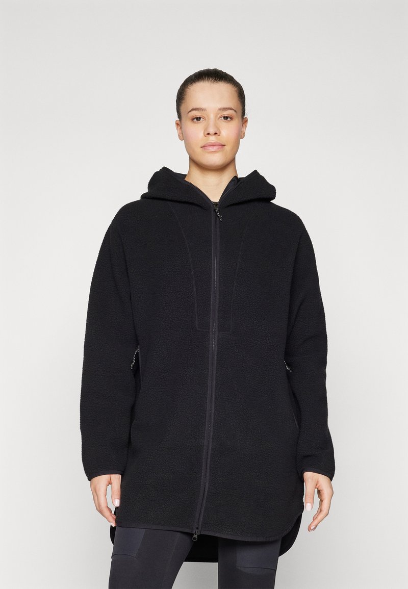 Zwarte fleece zip-up hoodie met een capuchon, geweven stof, lange mouwen en zijzakken. Heeft een rechte snit en subtiele stikseldetails.