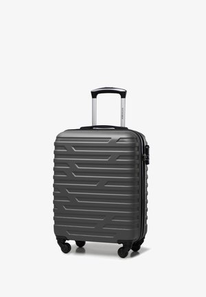 Valigia rigida grigia con superficie texturizzata, design a coste, quattro ruote e manico estensibile. Dispone di una chiusura a zip.