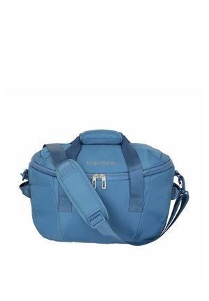 Blauer Travelite-Reisetasche mit zwei Griffen, verstellbarem Schulterriemen und Reißverschlusstasche vorne.