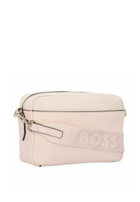 Borsa a tracolla rosa pallido realizzata in pelle, con chiusura zip, tracolla regolabile con logo impresso e design minimalista.