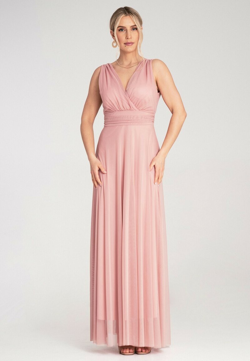 Maxi sukienka w delikatnym różu, z kopertowym dekoltem, bez rękawów i zwiewnym dołem. Wykonana z lekkiego materiału o gładkim wykończeniu.