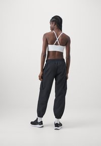 Under Armour UNSTOPPABLE - Trousers - black