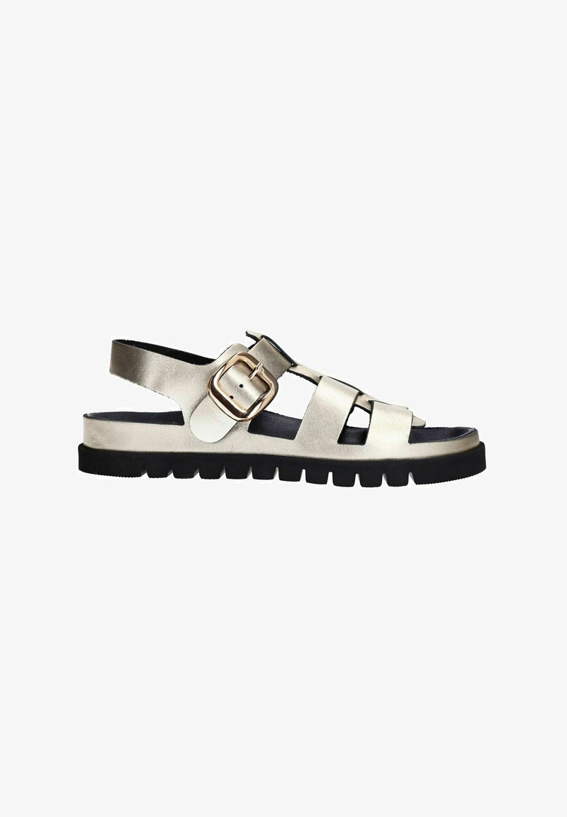 Metallic gold sandal featuring an open design, adjustable ankle strap with a buckle, and a thick black sole with textured tread.