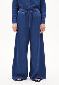 Wijde denim broek in donkerblauw, met een elastische tailleband met trekkoorden, een gladde textuur en een relaxte pasvorm.