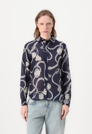 Marineblå knapp-up skjorte laget av lett stoff, med et tau-mønster og kremfargede detaljer, samt klassisk krage. Lange ermer.