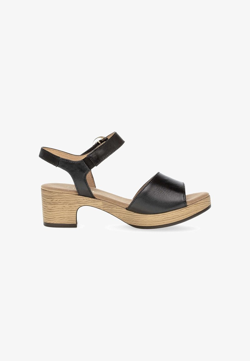 Black leather open-toe sandal with adjustable ankle strap and wooden block heel, featuring a cushioned footbed and textured sole.