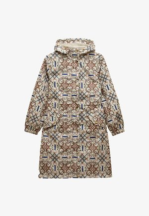 Krēma krāsas lietusmētelis ar kapuci, elastīgiem piedurkņu galiem un brūnu, zilu un zaļu jāšanas stilu iedvesmotu ķēžu un sprādžu rakstu.