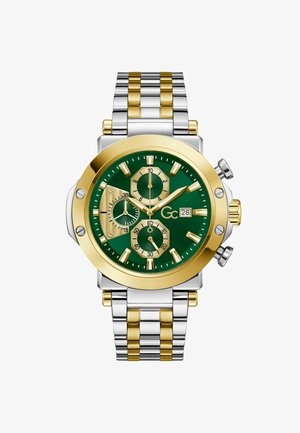 Dwukolorowy srebrno-złoty zegarek na nadgarstek z zieloną tarczą, trzema podtarczami, wyświetlaczem daty oraz złotymi wskazówkami i znacznikami godzin.