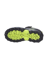 Schwarze Sport-Schuhsohle mit leuchtend grünen Gummitraktionsnoppen. Strukturiert und mit geometrischen Mustern für verbesserten Halt und Flexibilität.