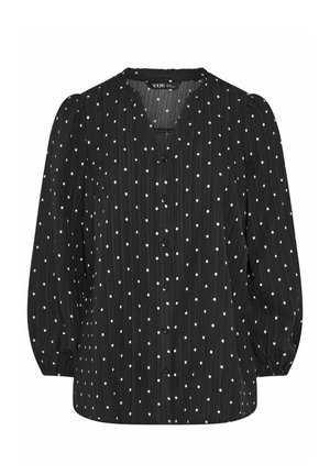 Schwarze Langarmbluse mit weißen Polka-Dots, durchgehender Knopfleiste, leicht puffigen Ärmeln und rundem Ausschnitt.