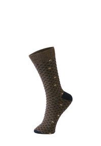Calzini marroni con un motivo a pois in blu navy e crema. Cuffia a coste, texture liscia e una sezione solida in blu navy per il tallone e la punta.