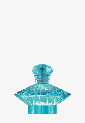 Bottiglia di profumo in vetro trasparente blu con design geometrico sfaccettato e tappo rotondo su sfondo bianco.