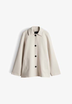 Beige wollen jas met een kraag, zwarte knoopsluiting, twee voorzakken en een A-lijn silhouet. Gladde textuur en minimalistisch ontwerp.