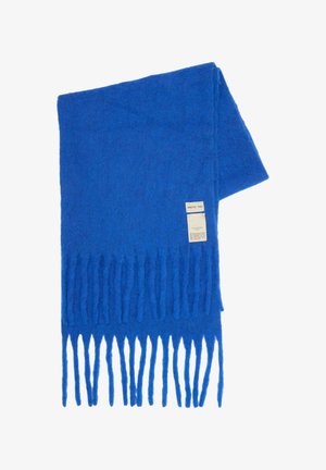 Blue wool scarf with long fringes and a white label that reads "Arctic Fox" folded on a white background.