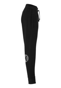 Sorte joggers lavet af blødt stof, med tapered ben, elastisk talje med snøre og et reflekterende logo på venstre læg.