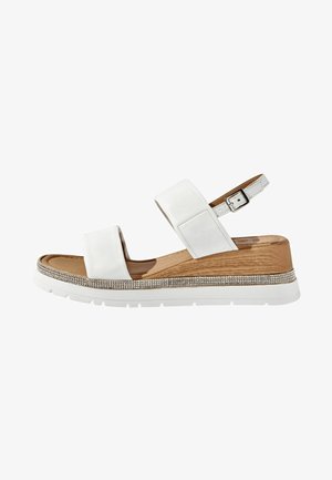 Sandali wedge bianchi in pelle con due cinturini larghi, una cinghia regolabile alla caviglia, una suola simile al legno e un fondo decorato con strass.