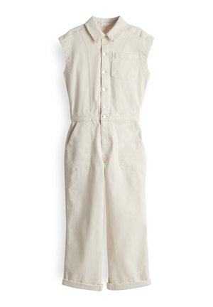 Tuta senza maniche beige realizzata in tessuto resistente, con collo a camicia, chiusura frontale con bottoni, una tasca sul petto e due tasche laterali.