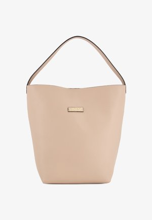 Beżowa skórzana torba typu bucket z pojedynczym uchwytem i złotą plakietką z logo "Venezia" umieszczoną na środku przodu.