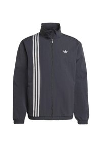 Black zip-up jacket with high collar, featuring three white vertical stripes on the left side and a small logo on the chest. Lightweight material.