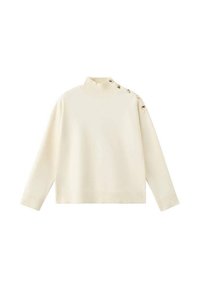 Pulover crem cu guler înalt, umeri căzuți și accente cu nasturi pe un umăr. Realizat dintr-un material moale și texturat.