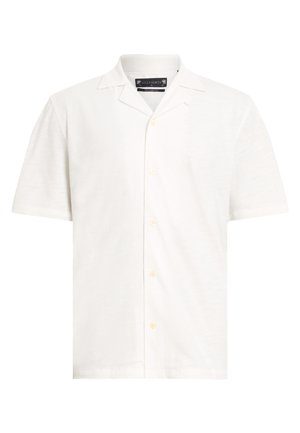 Kortärmad vit skjorta med avslappnad krage, med fem knappar fram. Tillverkad av ett texturerat, lättviktigt tyg.