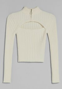 Ribbad krämfärgad tröja med hög krage och bakdragkedja. Har en utskärning fram, långa ärmar och en figurnära silhuett.