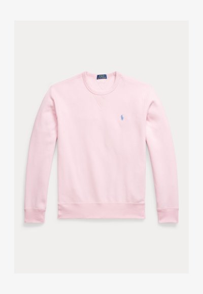 Sweatshirt rosa claro feita de algodão, com mangas compridas, gola redonda e um pequeno logótipo azul bordado no peito.