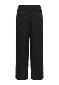 Pantalon large noir texturé avec taille élastique, sans poches visibles ni fermetures, présenté sur fond blanc.