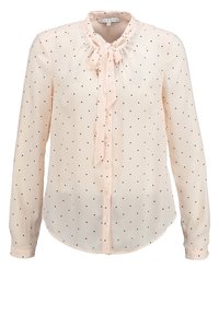 Blouse rose clair en tissu transparent, ornée de pois noirs, avec un col lavallière et un devant boutonné, manches longues.