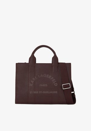 Dark brown leather tote bag with two handles, an adjustable shoulder strap, and embossed text "Karl Lagerfeld Paris 21 Rue St-Guillaume."