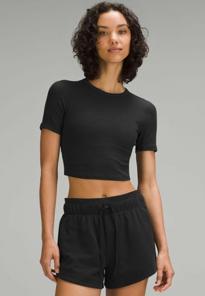 lululemon HOLD TIGHT STRAIGHT HEM CROPPED - T-shirts basic - black