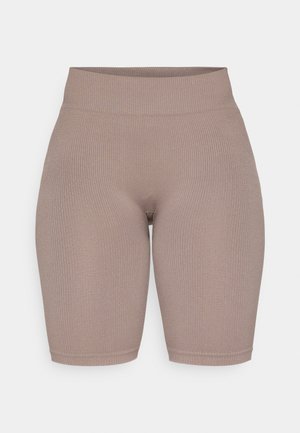 High-waisted ribbed bike shorts in muted taupe, featuring a smooth texture and an elastic waistband for comfort and fit.