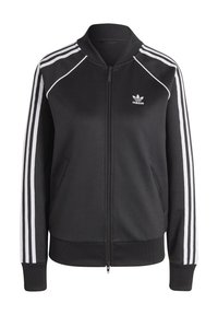 Svart Adidas zip-up jacka med vita ränder längs ärmarna, ribbade manschetter, krage och midja, med Adidas trefoil-logotyp på bröstet.