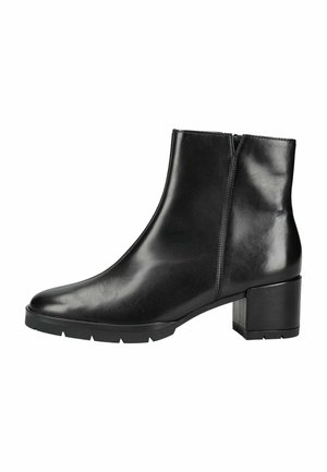 Stivaletto alla caviglia in pelle nera con tacco basso a blocco, punta tonda, cerniera laterale e suola in gomma con leggera scolpitura.