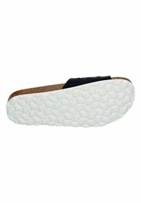 Black slide sandal with a cork footbed and a textured white rubber outsole featuring a wavy pattern for grip and comfort.