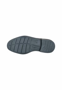 Suela de zapato de goma negra con un patrón de relieve que presenta surcos horizontales y verticales. Marcada con la marca "bugatti" y la talla "42."
