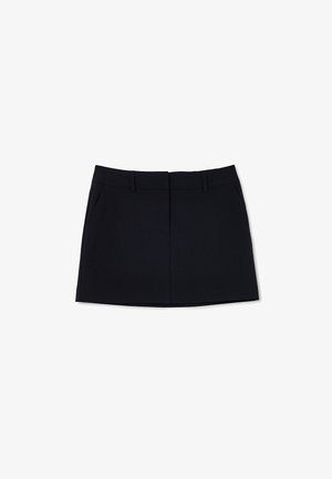 Black mini skirt with a fitted design, featuring two side pockets and a front seam detail. Made of a smooth, lightweight fabric.