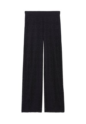 Zwarte wijde broek van gestructureerde kanten stof met een cirkelpatroon en een elastische tailleband. Het ontwerp benadrukt een vloeiende silhoutte.