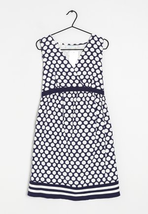 Navy- und weiße Polka-Dot-Kleid mit V-Ausschnitt und A-Linienform. Verfügt über eine taillierte Taille und ein gestreiftes Saumdetail. Hergestellt aus leichtem Stoff.