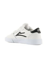 White lace-up sneaker with a textured design, black logo accent on heel, and a white rubber sole. Smooth synthetic material.